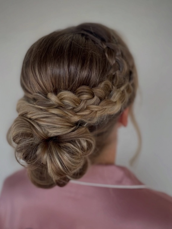 Braided low bun by Hannah, from behind