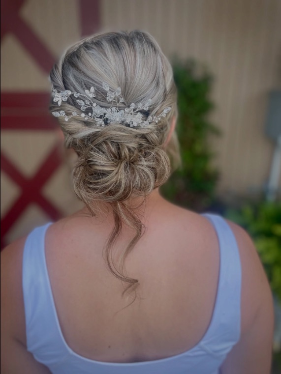 Textured low bun with a crystal vine, from behind